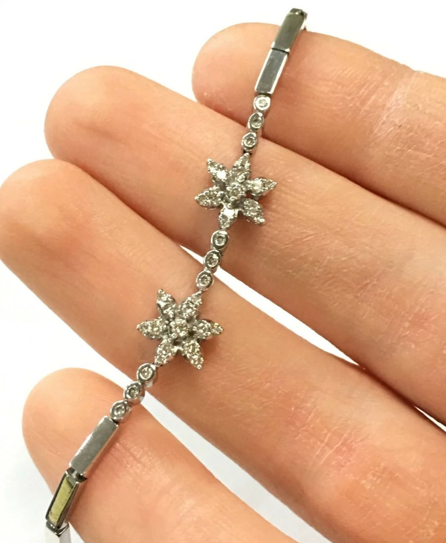 18K WHITE GOLD DIAMOND FLOWER STYLE BRACELET 7.75 INCHES LONG 10.7 GRAMS: 18k White Gold Diamond Flower Style Bracelet You are bidding on a 18k White Gold Diamond Flower Style Bracelet. The piece has been fully checked, cleaned, buffed and polished by our in house Jewelers.