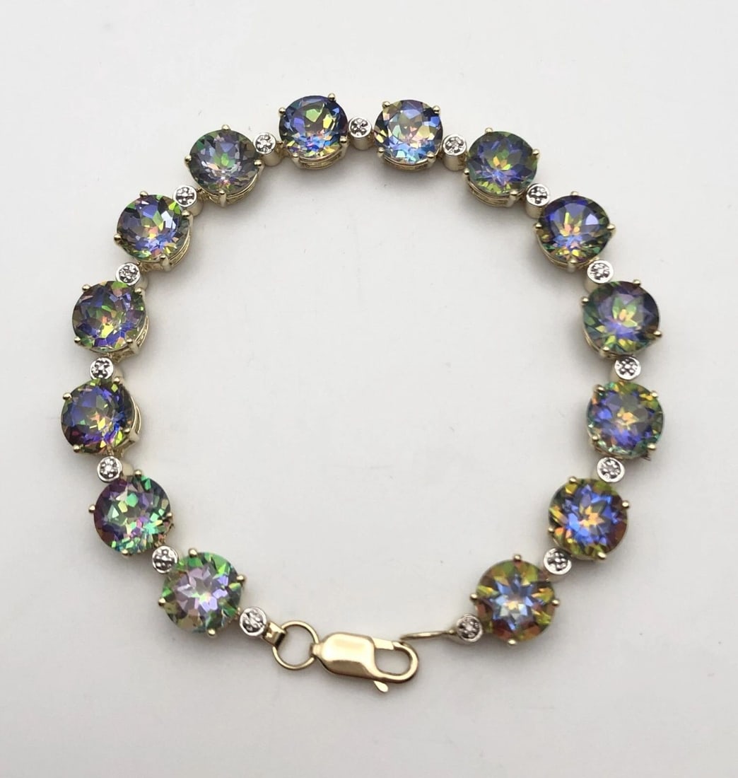 14K YELLOW GOLD BRACELET SET WITH MYSTIC TOPAZ AND 0.04 CTS OF DIAMONDS 7.25": 14K YELLOW GOLD BRACELET SET WITH MYSTIC TOPAZ AND 0.04 CTS OF DIAMONDS 7.25" 14k Yellow Gold Bracelet set with Mystic Topaz and 0.04 cts of Diamonds You are bidding on a 14k Yellow Gold Bracelet set