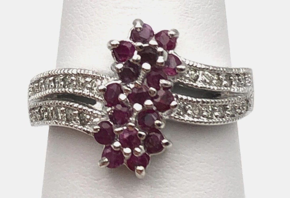 18K WHITE GOLD RING WITH NATURAL RUBY CLUSTER AND 0.20CTW DIAMONDS SIZE: 6.5: 18k White Gold Ring with center Ruby cluster and 0.20cts of Diamonds Condition: New with original tag, has been moved around in inventory. Material: 18k White Gold Ring Size: 6.5 Weight: 6.5 grams Top