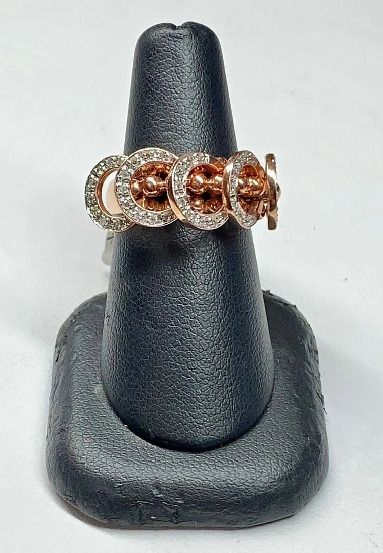 14K ROSE GOLD RING WITH DIAMONDS AND 5 ROSE GOLD HOOPS THAT MOVE FREELY: 14K ROSE GOLD RING WITH DIAMONDS AND 5 ROSE GOLD HOOPS THAT MOVE FREELY 14k Rose Gold Ring with Diamonds and 5 Rose Gold Hoops That Move Freely You are bidding on a new with defects 14k Rose Gold Ring