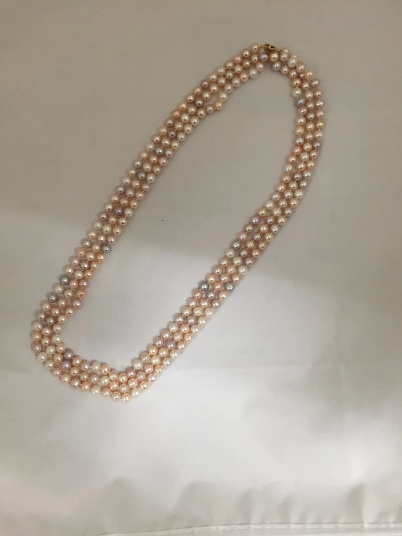 FRESHWATER PASTEL CULTURED 3 STRING PEARL NECKLACE: Freshwater Pastel Culture 3 Strand Pearl Necklace You are looking at a pre-owned Freshwater Pastel Culture 3 Strand Pearl Necklace. The necklace has close to no scuffs and is almost in mint condition.