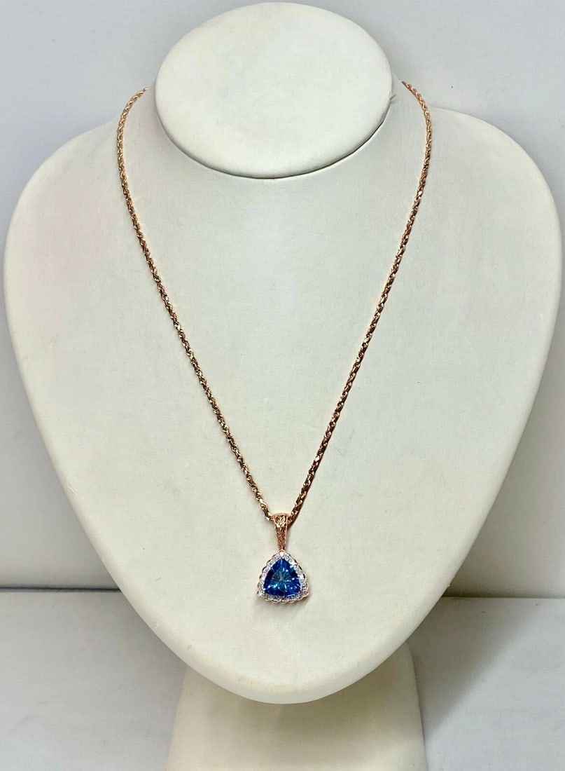 14K ROSE GOLD PENDANT BLUE TOPAZ AND DIAMONDS WITH 10KT ROSE GOLD NECKLACE: 14K ROSE GOLD PENDANT BLUE TOPAZ AND DIAMONDS WITH 10KT ROSE GOLD NECKLACE 14k Rose Gold Pendant Blue Topaz and Diamonds with 10k rose gold necklace You are bidding on a 14k Rose Gold Pendant Blue Top