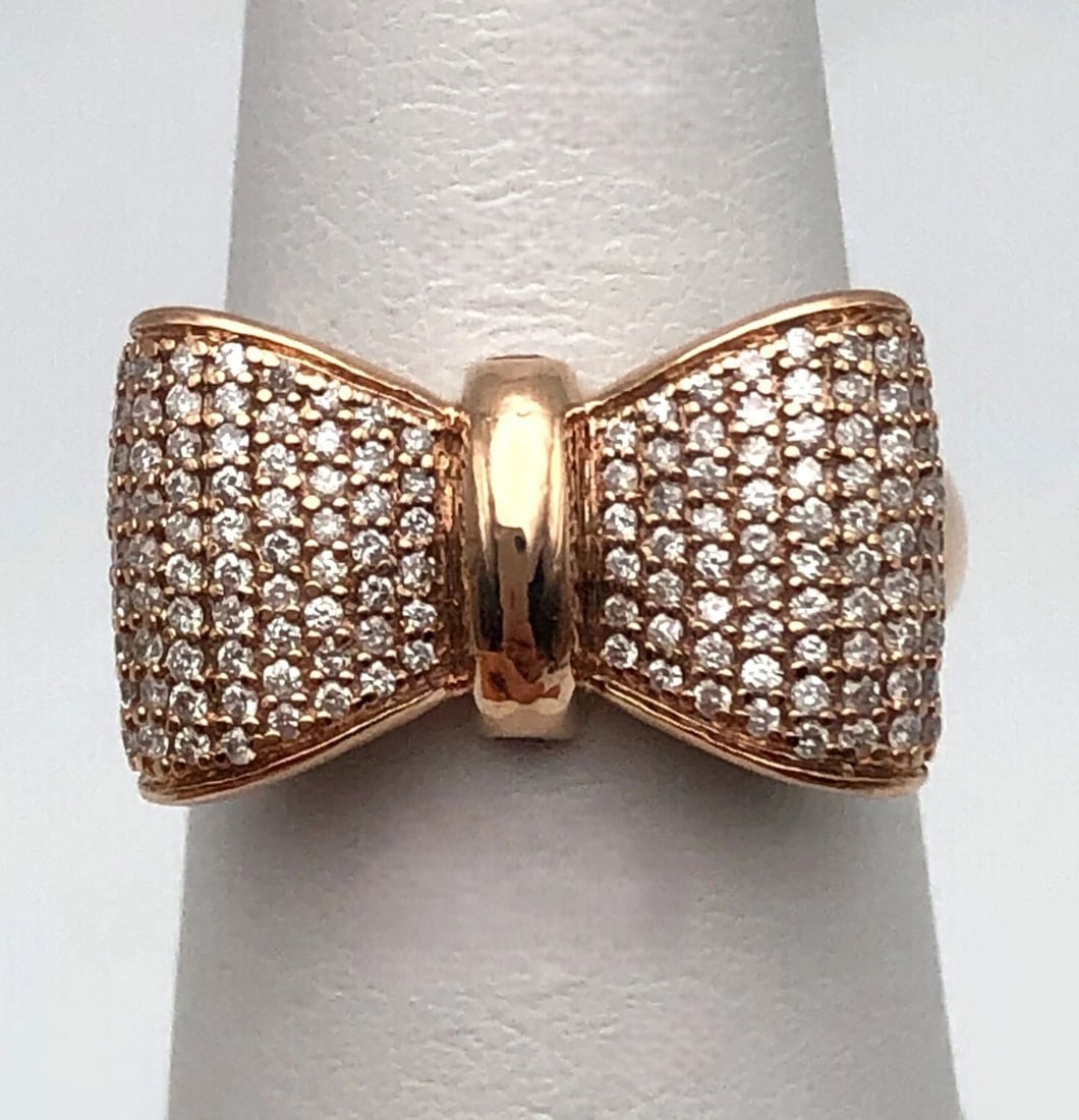 10K ROSE GOLD DISNEY SNOW WHITE BOW RING WITH RUBIES AND 0.50CTS OF DIAMONDS: 10k Rose Gold Disney Snow White Bow Ring with Rubies and 0.50cts of Diamonds Condition: Used, moved around in display, few minor scratches from normal wear/tear Material: 10k Rose Gold Ring Size: 6 We