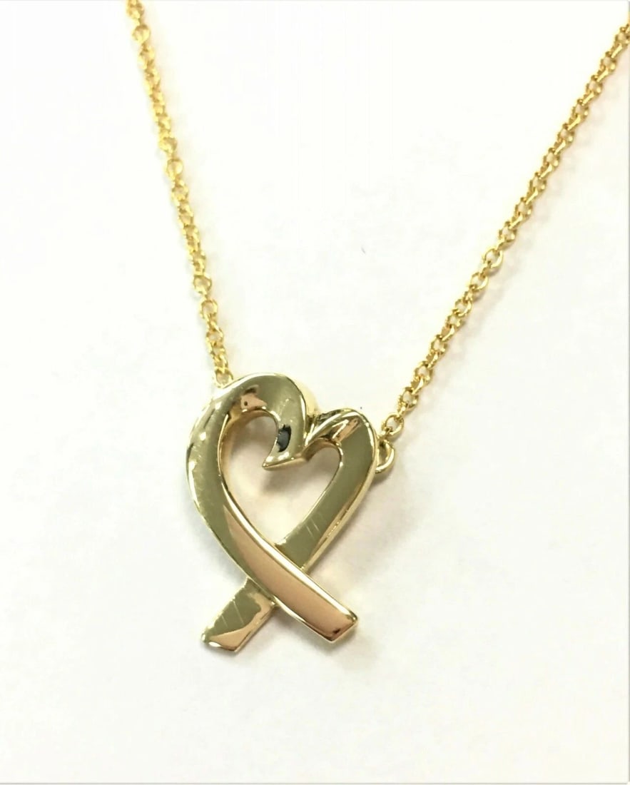 TIFFANY & CO PALOMA PICASSO 18K YELLOW GOLD LOVING HEART PENDANT NECKLACE: Tiffany & Co Paloma Picasso 18K Yellow Gold Loving Heart Pendant Necklace You are bidding on a Tiffany & Co Paloma Picasso 18K Yellow Gold Loving Heart Pendant Necklace. The piece is used and has some