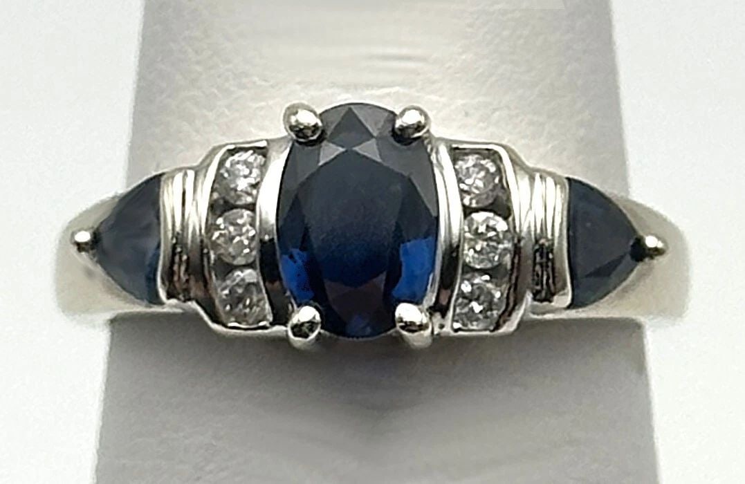 14K WHITE GOLD RING WITH 1.8CTS NATURAL SAPPHIRES, 0.12CTS DIAMONDS SIZE: 6.25: 14k White Gold Ring with Sapphires and 0.12cts of Diamonds Condition: Used, has been cleaned Material: 14k White Gold Ring Size: 6.25 Weight: 4.1 grams Top Width: 7.1mm Bottom Width: 1.7mm Stone Info: