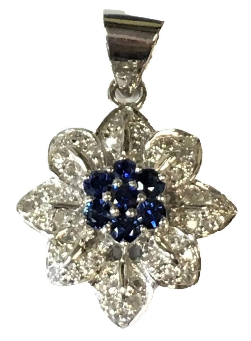 14K WHITE GOLD FLOWER PENDANT WITH BLUE SAPPHIRES AND DIAMONDS 4.2G: 14K WHITE GOLD FLOWER PENDANT WITH BLUE SAPPHIRES AND DIAMONDS 14k White Gold Flower Pendant with Blue Sapphires and Diamonds You are bidding on a 14k White Gold Flower Pendant with Blue Sapphires and