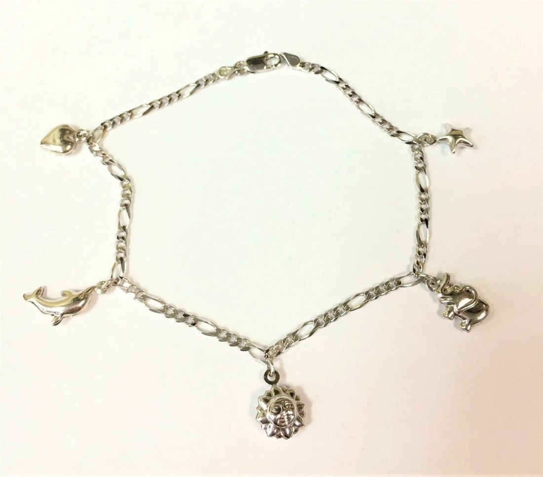 14K WHITE GOLD WOMAN'S ANKLET WITH MULTIPLE CHARMS 9 INCHES 7.1G: 14K WHITE GOLD WOMAN'S ANKLET WITH MULTIPLE CHARMS 9 INCHES 14k White Gold Woman's Anklet with Multiple Charms 9inches You are bidding on a pre-owned 14k White Gold Woman's Anklet with Multiple