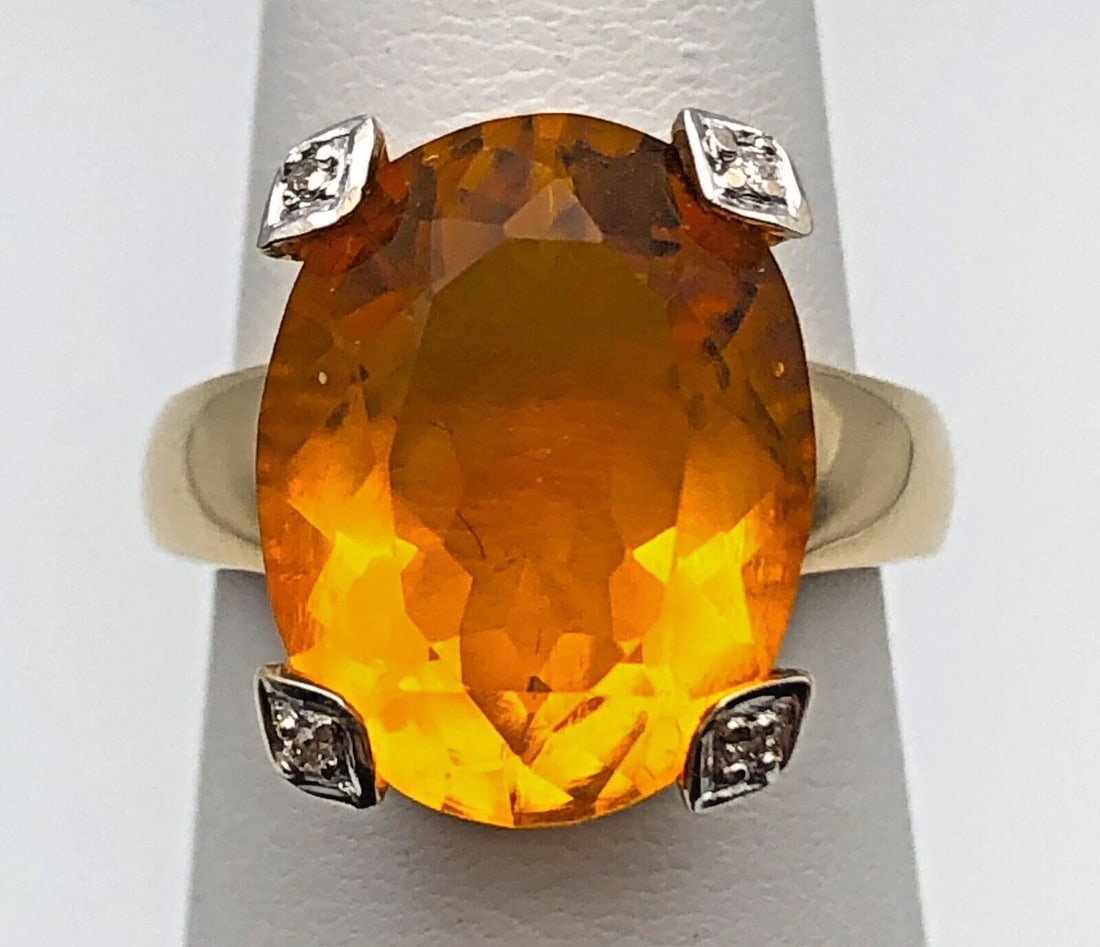 14K GOLD RING SET WITH 9CT CITRINE AND WITH 0.13CTS OF DIAMONDS SIZE: 6.25: 14k Gold Ring set with 9ct Citrine and with 0.13cts of Diamonds Condition: Used , display model has been moved around in inventory Material: 14k Yellow Gold Ring Size: 6.25 Weight: 6.4 grams Top