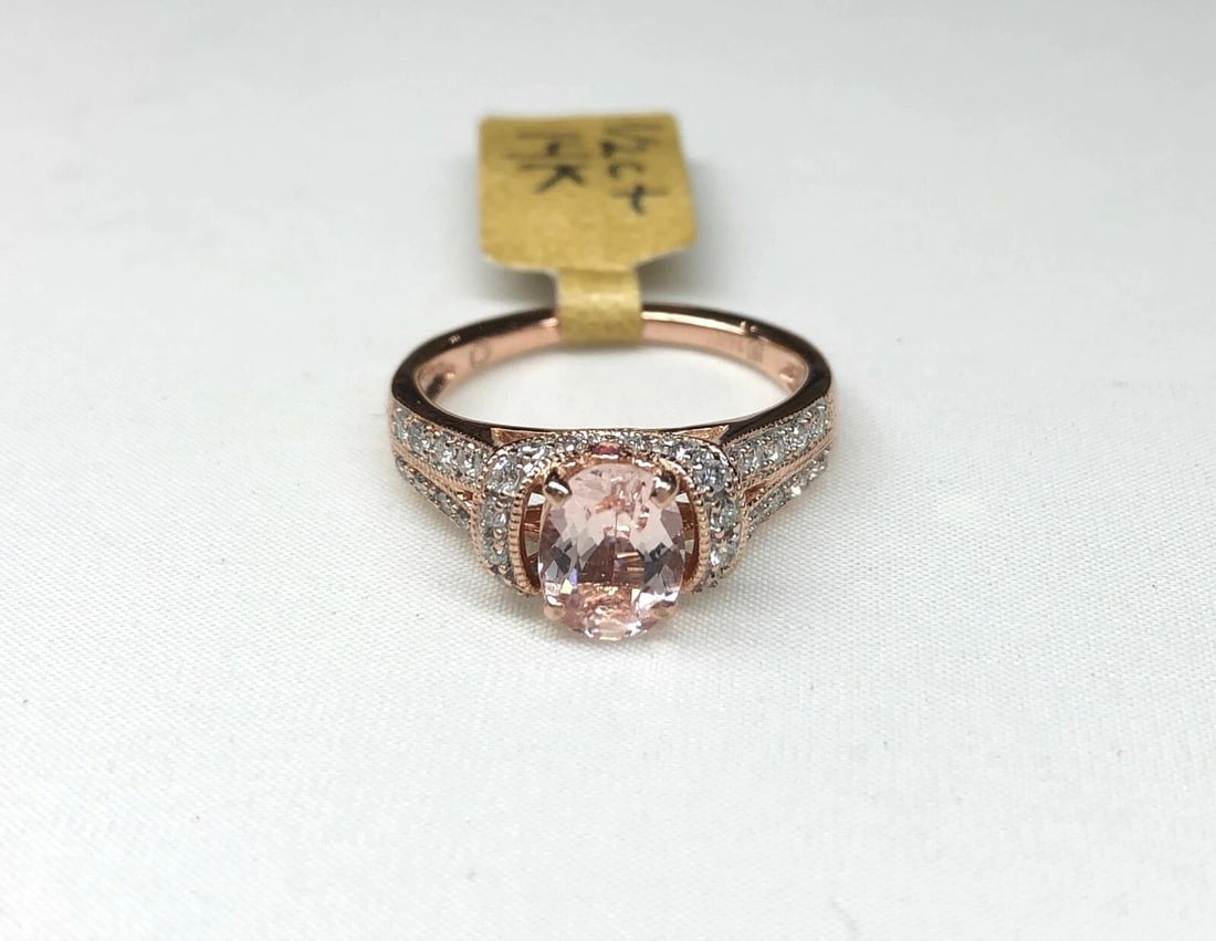 WOMEN'S 14K ROSE GOLD KUNZITE RING WITH DIAMONDS: Women's 14k Rose Gold Kunzite Ring with Diamonds You are bidding on a pre-owned Women's 14k Rose Gold Kunzite Ring with Diamonds. The ring has minor scuffs and scratches from normal wear and tear,