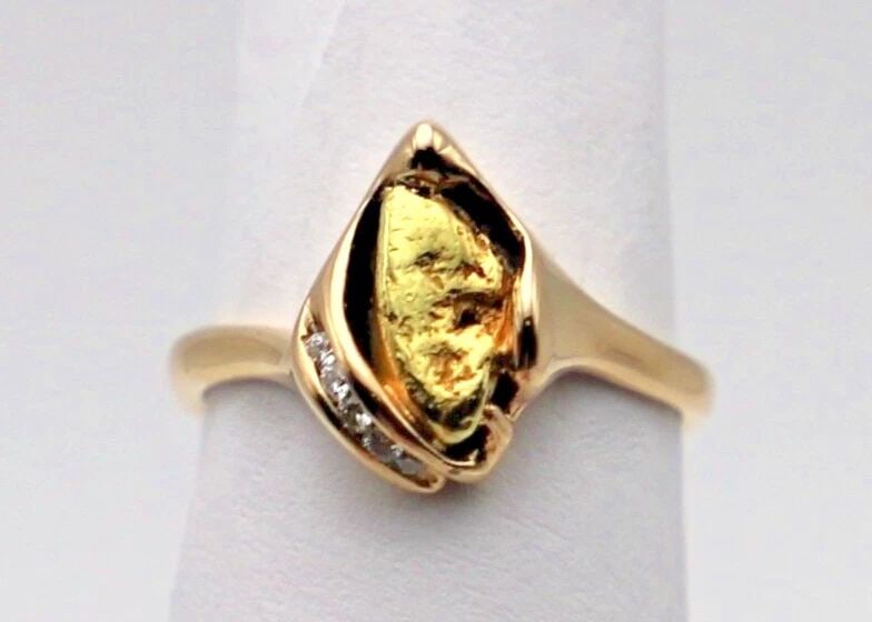 14K GOLD RING WITH 24K GOLD NUGGET CENTER AND 0.05CTS OF DIAMONDS SIZE 5.25: 14k Gold Ring with 24k Gold Nugget center and 0.05cts of Diamonds You are bidding on a 14k Gold ring with 24k Gold Nugget center and accented Diamonds Size 5.25. The ring has been fully checked and in