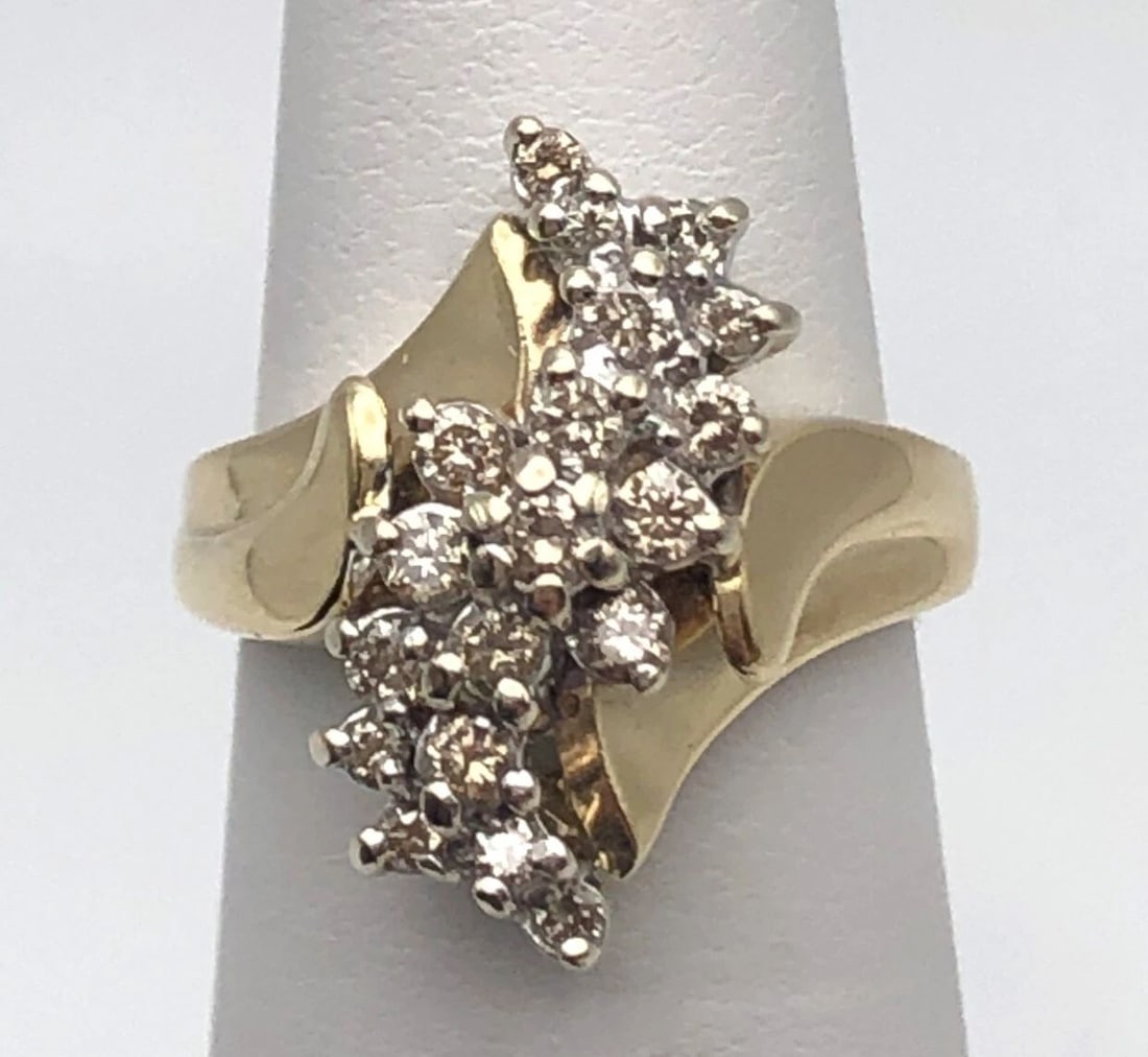 10K GOLD RING WITH MARQUISE SHAPED CHAMPAGNE DIAMOND CLUSTER 0.75CTW SIZE: 5.25: 10k Gold Ring with marquise shaped Champagne Diamond Cluster 0.75ctw Condition: Used, has been cleaned Material: 10k Yellow Gold Ring Size: 5.25 Weight: 5.0 grams Top Width: 19mm Bottom Width: 2mm Sto