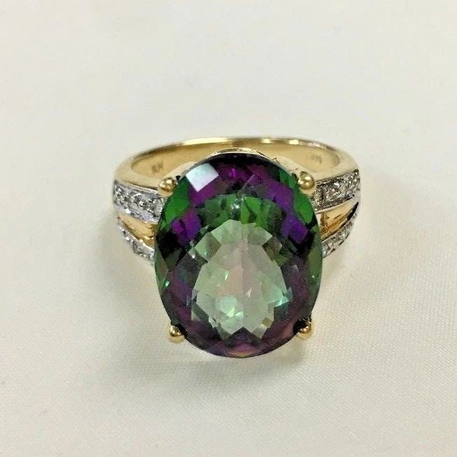 14K YELLOW GOLD WITH MYSTIC TOPAZ AND DIAMONDS SIZE 7: 14k Yellow Gold with Mystic Topaz and Diamonds size 7 You are bidding on a 14k Yellow Gold with Mystic Topaz and Diamonds. The ring is in excellent condition. See pictures for details. Features 14k ye