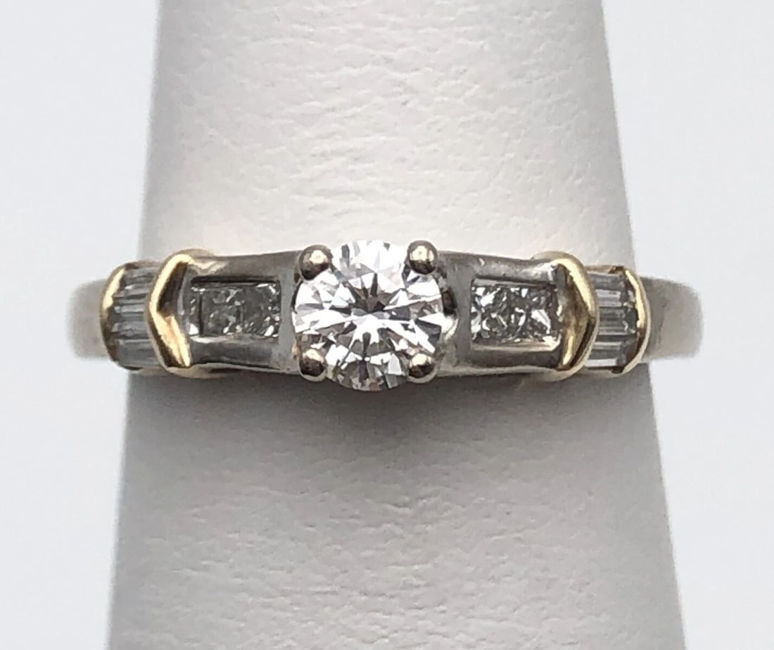 14K WHITE GOLD RING WITH YELLOW GOLD TRIMMING AND 0.50CTW VS DIAMONDS SIZE: 5.5: 14k White Gold Ring with Yellow Gold trimming and 0.50cts of Diamonds two tone Condition: Display Model, No box tags or papers Material: 14k White Gold with yellow gold trimming Ring Size: 5.5 Weight: