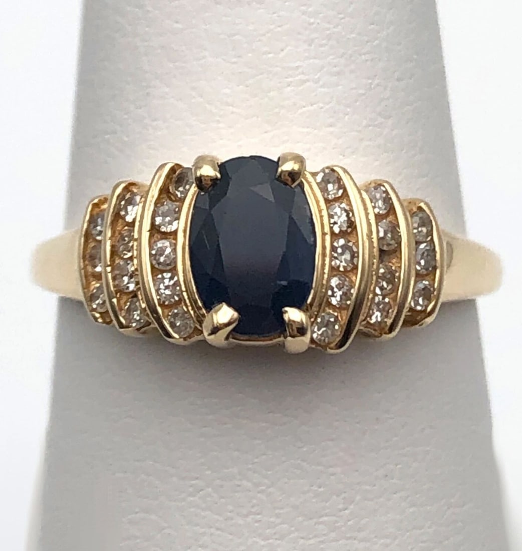 14K GOLD RING WITH 1.0CT SAPPHIRE, 0.25CTS OF DIAMONDS SIZE: 7.75 3.1G: 14k Gold Ring with 1.0ct Sapphire, 0.25cts of Diamonds Condition: Used, has been cleaned Material: 14k Yellow Gold Ring Size: 7.75 Weight: 3.1 grams Top Width: 7.6mm Bottom Width: 1.7mm Stone Info: Ce