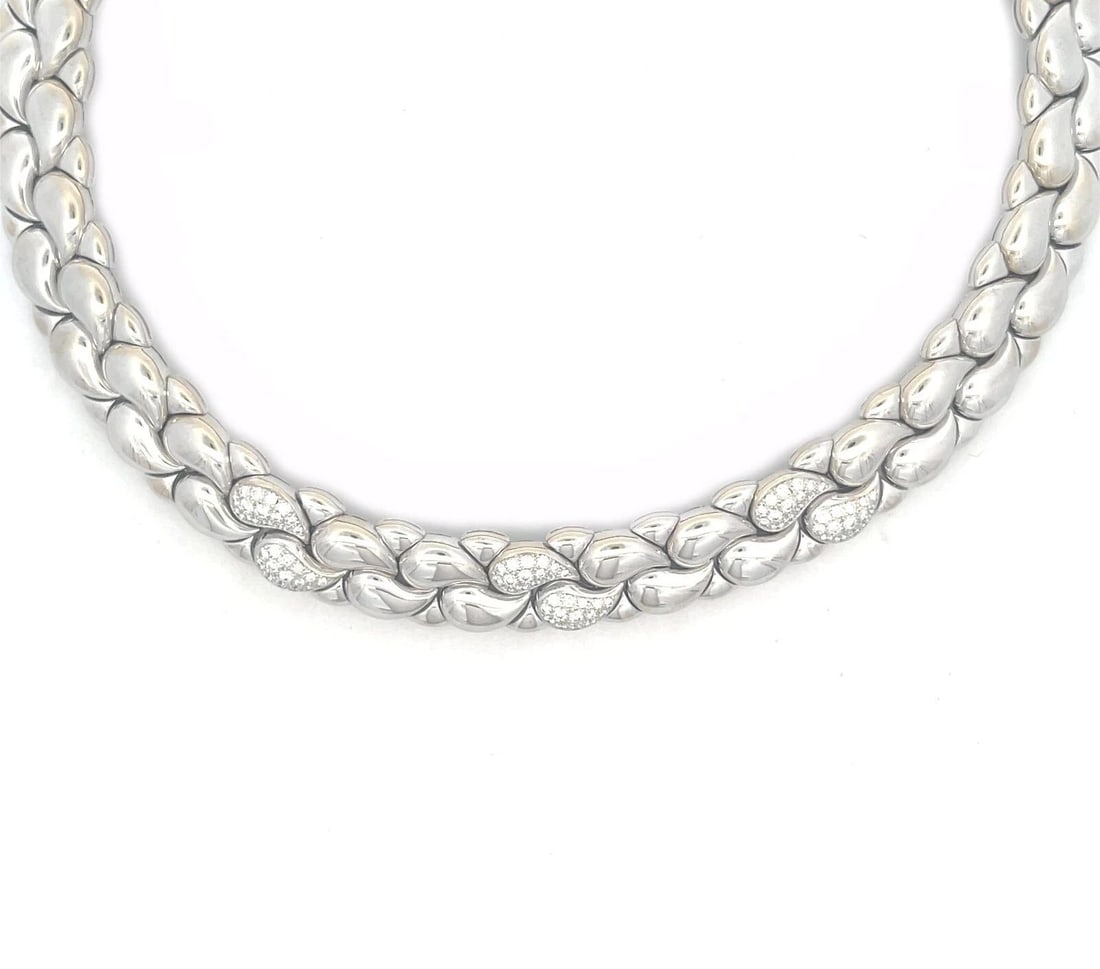 CHOPARD CASMIR DIAMOND GOLD NECKLACE 18K WHITE PAISLEY MOTIFS: CHOPARD CASMIR DIAMOND GOLD NECKLACE 18K WHITE PAISLEY MOTIFS This gorgeous authentic necklace is by Chopard from the Casmir Collection. It is crafted from 18k white gold with a polished finish featur