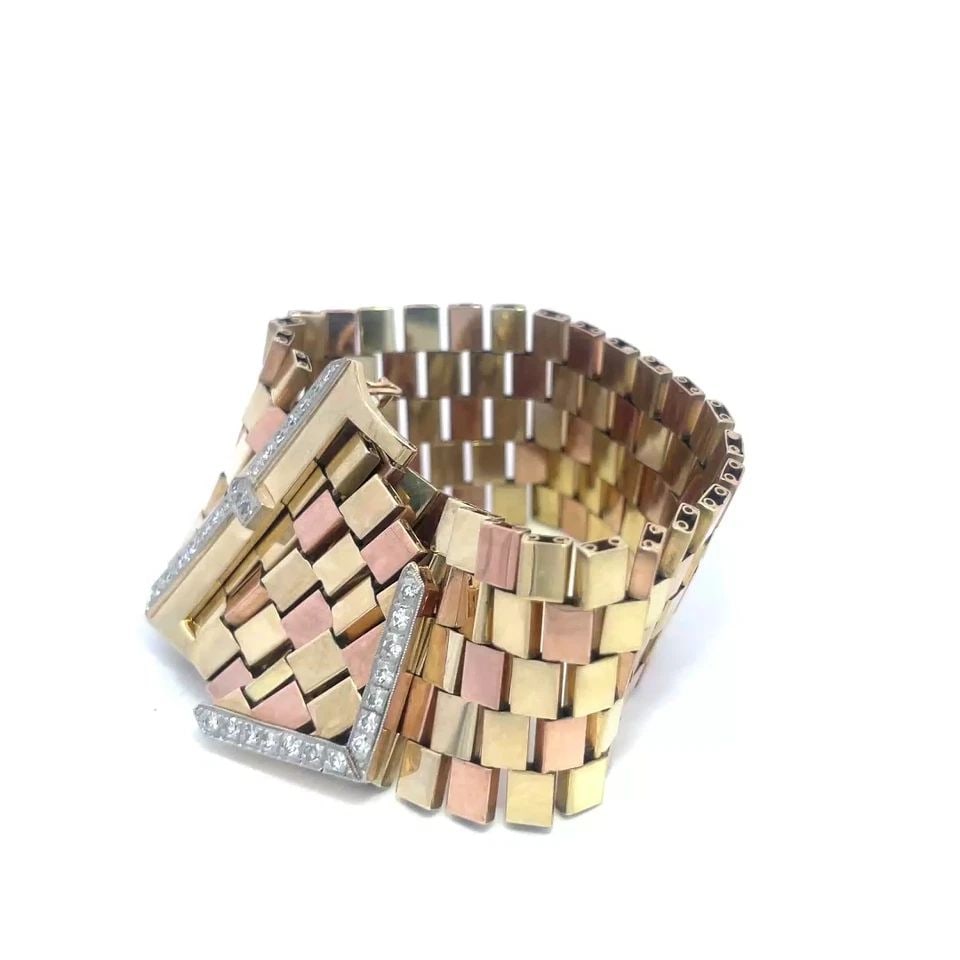 RETRO DIAMOND GOLD BELT BRACELET 14K TRI-COLOR WIDE FLEX LINK BUCKLE STYLE: RETRO DIAMOND GOLD BELT BRACELET 14K TRI-COLOR WIDE FLEX LINK BUCKLE STYLE The Retro Diamond Gold Belt Bracelet is a stunning piece of fine jewelry featuring 5 rows with small bar link in 14k rose and