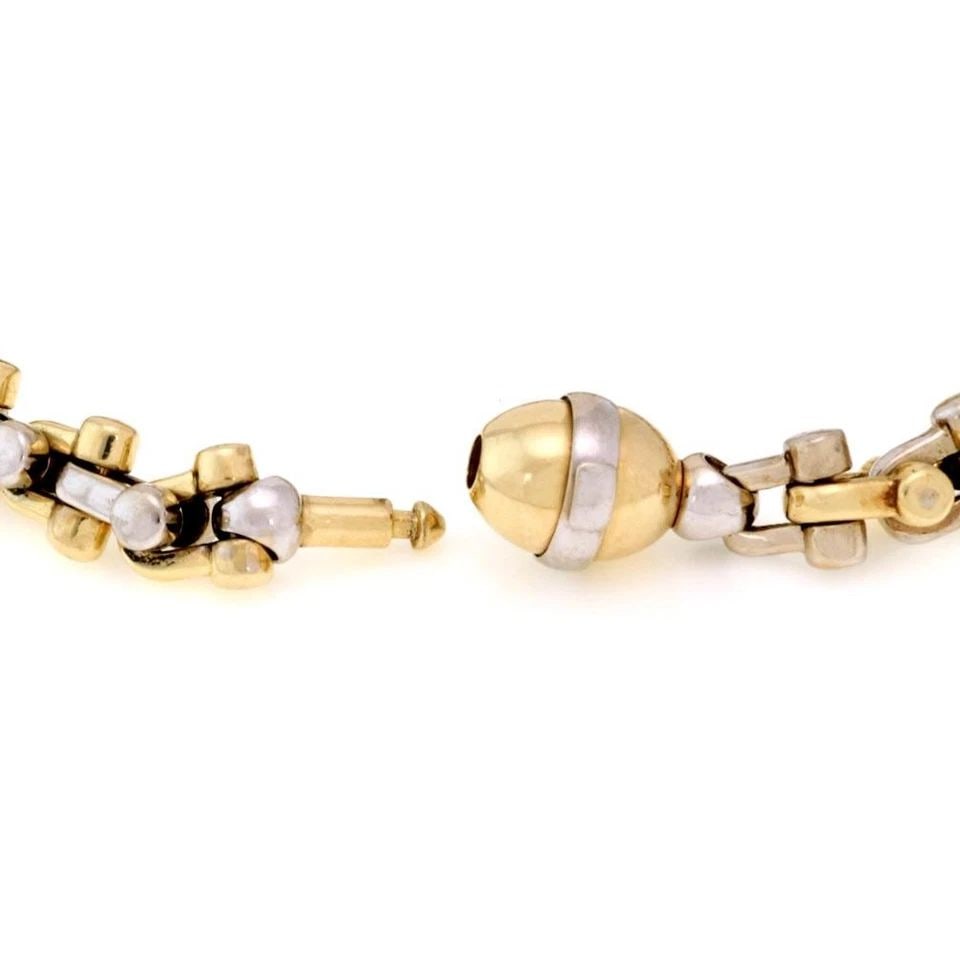 BRACCIO 14K TWO TONE HEFTY STIRRUP LINK BRACELET 76.6GR!: Braccio 14k Two Tone Hefty Stirrup Link Bracelet 76.6gr! Description This is a hefty authentic bracelet by Italian designer Braccio, it is crafted from 14k yellow and white gold featuring stirrup desi