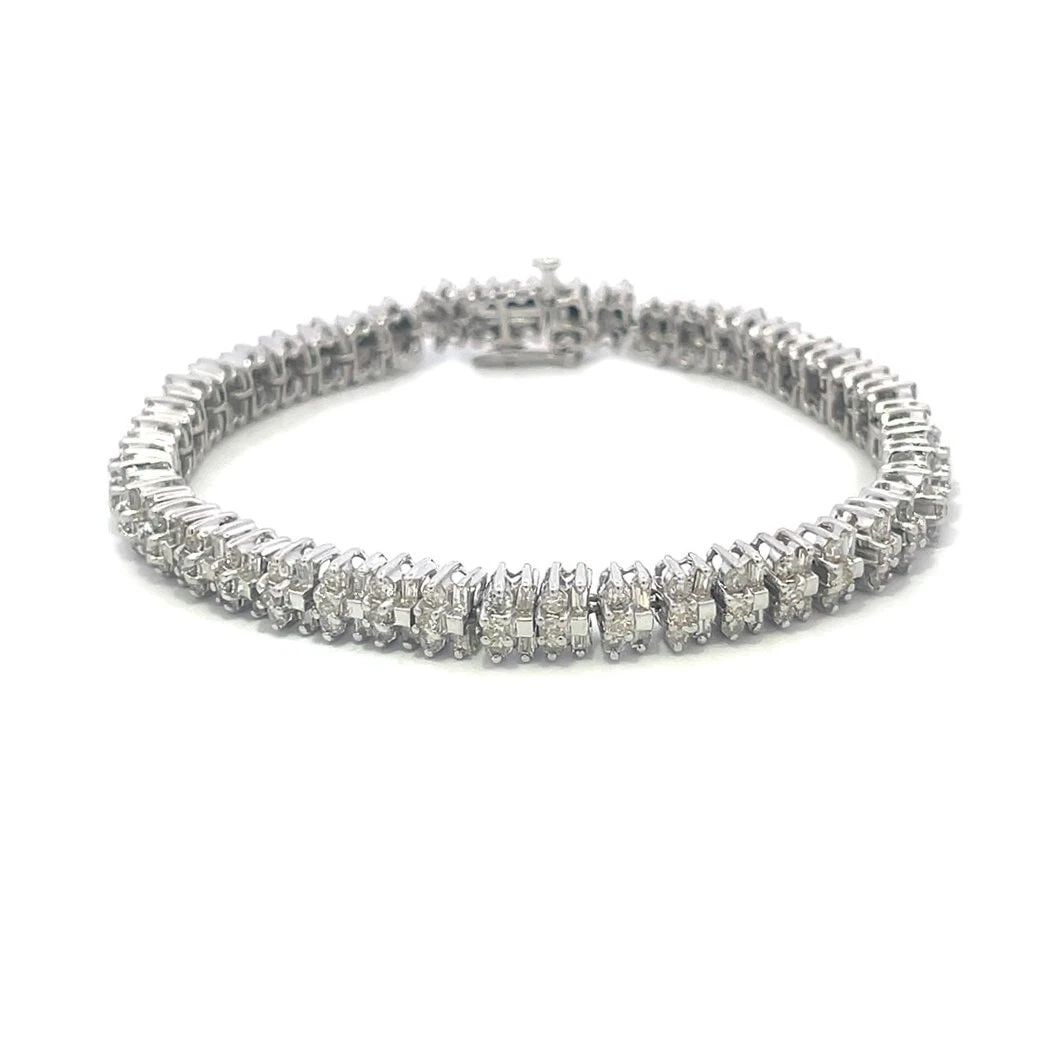 DIAMOND GOLD TENNIS BRACELET 14K WHITE CLUSTER BAGUETTE AND ROUND: DIAMOND GOLD TENNIS BRACELET 14K WHITE CLUSTER BAGUETTE AND ROUND 4. This is a stunning diamond tennis bracelet, it is crafted from 14k white gold with a polished finish featuring flex small link fram