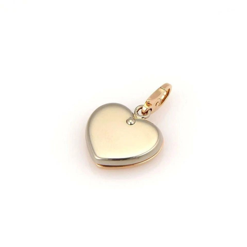 CARTIER 18K PINK & WHITE GOLD DOUBLE HEARTS CHARM PENDANT: CARTIER 18K PINK & WHITE GOLD DOUBLE HEARTS CHARM PENDANT Cartier 18k Pink & White Gold Double Hearts Charm Pendant Description This authentic Cartier pendant is crafted from 18k white and pink gold. 