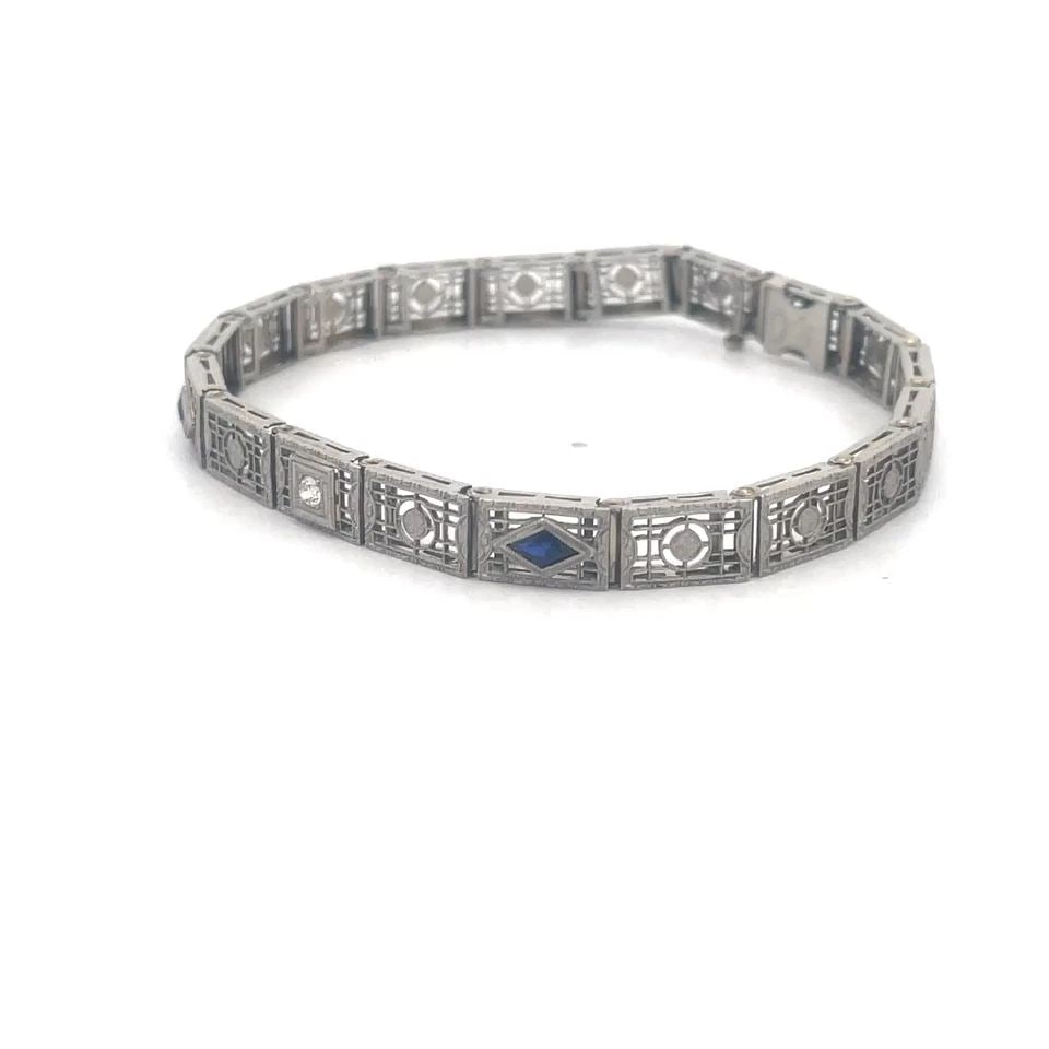ART DECO DIAMOND PLATINUM BRACELET 14K WHITE GOLD FILIGREE GATE LINK STYLE: ART DECO DIAMOND PLATINUM BRACELET 14K WHITE GOLD FILIGREE GATE LINK STYLE Adorn your wrist with the elegance of the Art Deco era with this lovely platinum top frame on 14k white gold base bracelet. T