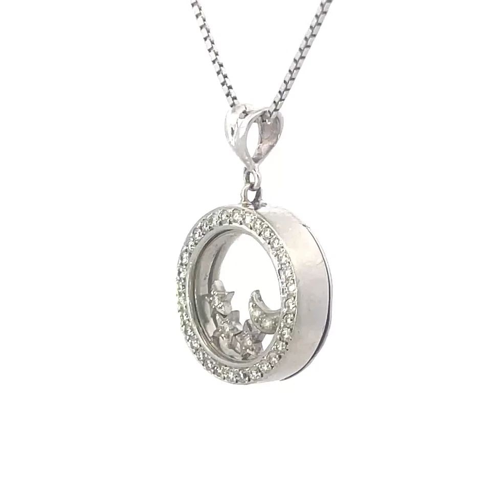 DIAMOND GOLD NECKLACE 14K WHITE FLOATING MOON & STARS BEZEL: DIAMOND GOLD NECKLACE 14K WHITE FLOATING MOON & STARS BEZEL This is a beautiful 14k white gold pendant and chain necklace; the pendant shape is round with double glass cover with diamond bezel, 1 floa