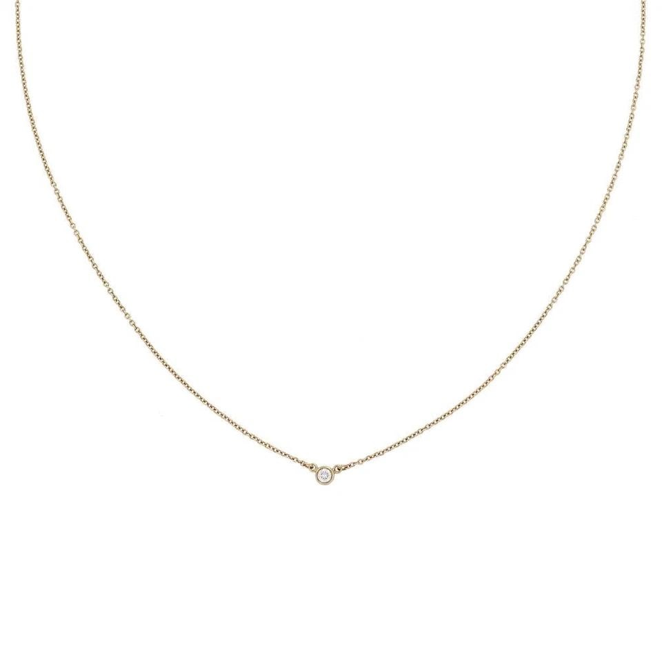 TIFFANY & CO. DIAMOND NECKLACE BY THE YARD 18K YELLOW GOLD SOLITAIRE PENDANT: TIFFANY & CO. DIAMOND NECKLACE BY THE YARD 18K YELLOW GOLD SOLITAIRE PENDANT The Tiffany & Co. Diamond Necklace By The Yard is a stunning piece of fine jewelry crafted in 18k yellow gold. The solitair