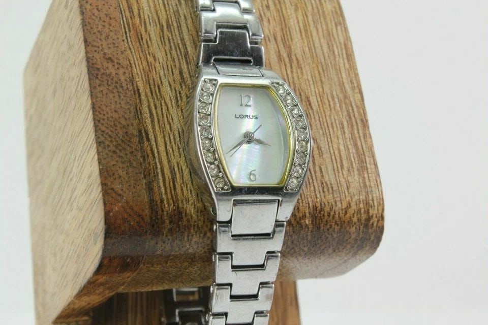 LORUS CRYSTAL ACCENTS MOTHER OF PEARL DIAL STAINLESS STEEL LADIES WATCH LR2117: LORUS CRYSTAL ACCENTS MOTHER OF PEARL DIAL STAINLESS STEEL LADIES WATCH LR2117 Description LORUS CRYSTAL ACCENTS MOTHER OF PEARL DIAL STAINLESS STEEL LADIES WATCH LR2117 New battery Installed. In