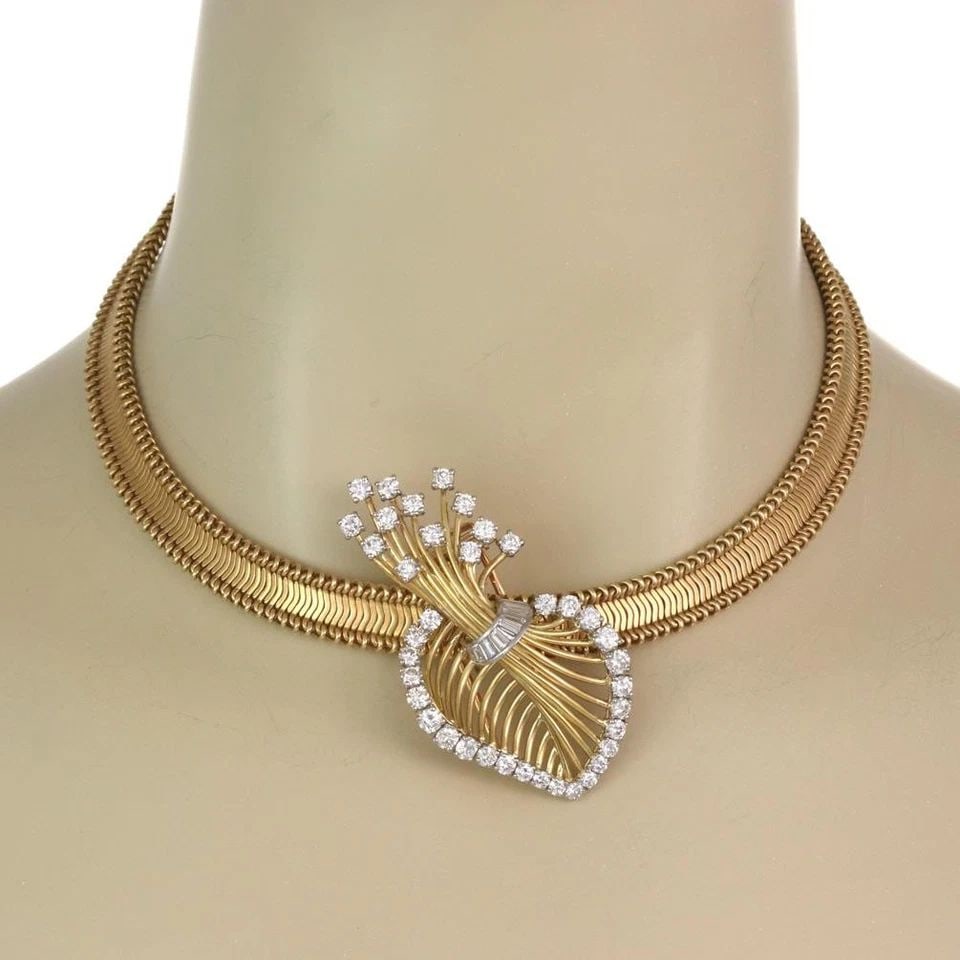 CARTIER GOLD NECKLACE PENDANT 1940'S DIAMOND 18K GOLD & PLATINUM: CARTIER GOLD NECKLACE PENDANT 1940'S DIAMOND 18K GOLD & PLATINUM This vintage Cartier gold necklace pendant from the 1940s features a beautiful floral sprig design with round & baguette diamonds set i