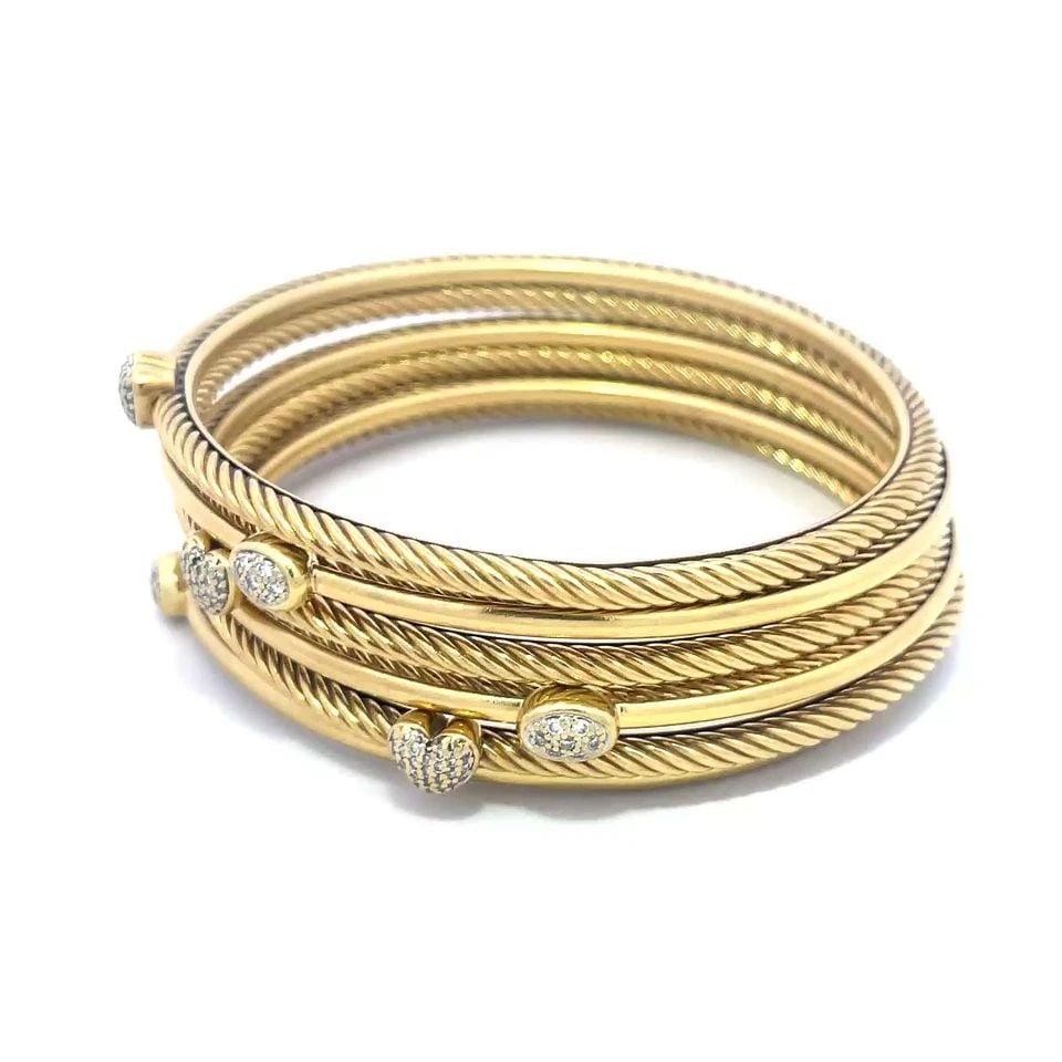 DAVID YURMAN SET OF 6 GOLD BANGLES DIAMOND 18K YELLOW 3MM CABLE STYLE: DAVID YURMAN SET OF 6 GOLD BANGLES DIAMOND 18K YELLOW 3MM CABLE STYLE These beautiful bangles are by David Yurman from his Classic Cable Collection. They are a set of 6 bangles crafted from 18k yellow