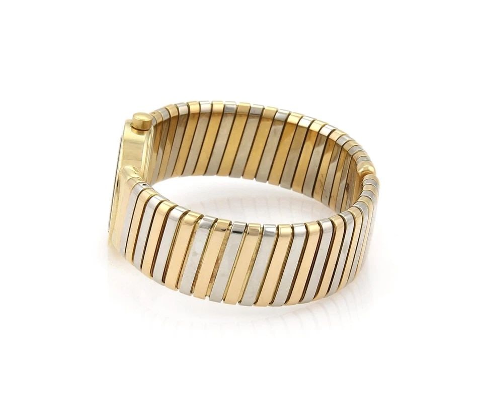 BULGARI 18K WATCH TRICOLOR GOLD TUBOGAS OPEN FLEX BAND QUARTZ: BULGARI 18K WATCH TRICOLOR GOLD TUBOGAS OPEN FLEX BAND QUARTZ Bvlgari Bulgari 18k Tricolor Gold Tubogas Open Flex Band Quartz Wrist Watch Description This elite authentic wrist watch is from Bvlgari, 