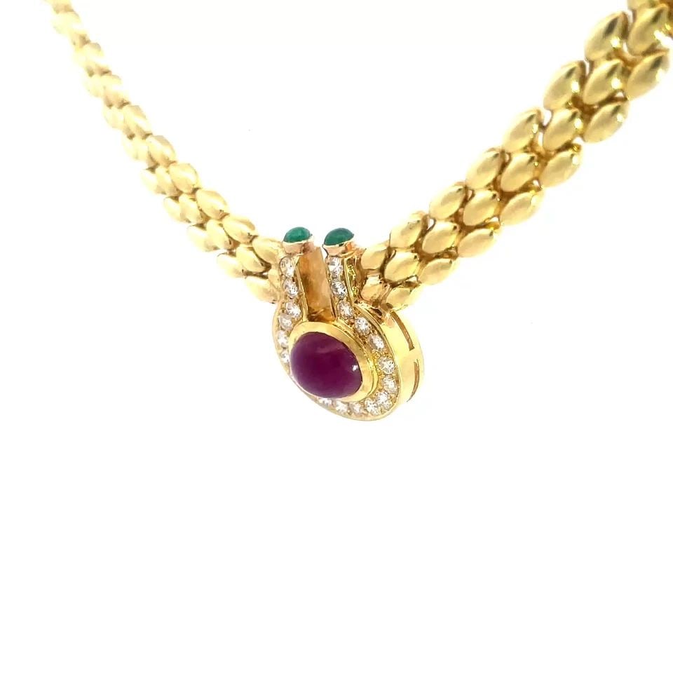 DIAMOND RUBY GOLD NECKLACE 18K YELLOW GENTIANE RICE LINK STYLE: DIAMOND RUBY GOLD NECKLACE 18K YELLOW GENTIANE RICE LINK STYLE The product is a stunning 18k yellow gold necklace featuring a unique open top centerpiece shaped like a bottle with a bezel set ruby in 