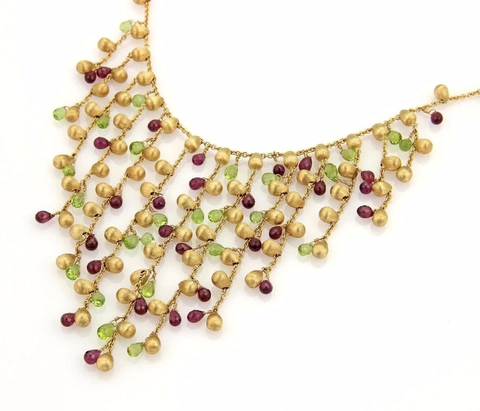 MARCO BICEGO PARADISE GOLD NECKLACE GEMSTONE 18K YELLOW FRINGE STYLE: MARCO BICEGO PARADISE GOLD NECKLACE GEMSTONE 18K YELLOW FRINGE STYLE This Marco Bicego Paradise Gold Necklace features a stunning fringe style design with red and green gemstones set in 18k yellow gol