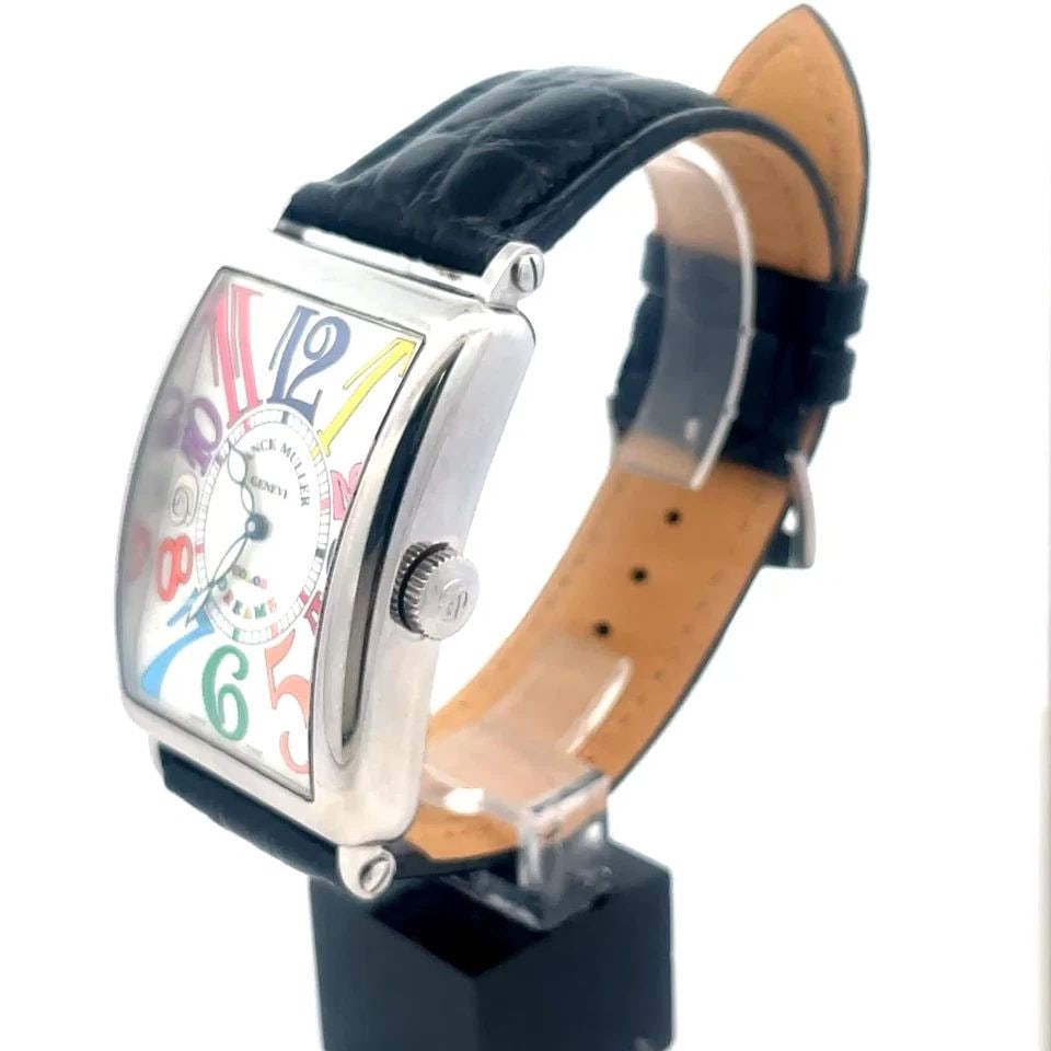 FRANCK MULLER MEN'S WATCH MASTER OF COMPLICATIONS LONG ISLAND COLOR DREAMS: FRANCK MULLER MEN'S WATCH MASTER OF COMPLICATIONS LONG ISLAND COLOR DREAMS This is a luxury Franck Muller men's wristwatch from the Color Dreams Collection, featuring a silver guilloche face with mult