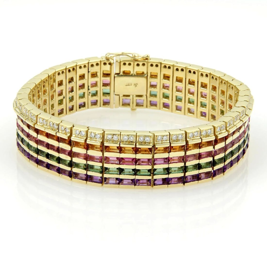 DIAMOND & GEMS GOLD BRACELET 18K YELLOW WIDE FLEX LINK BAND: DIAMOND & GEMS GOLD BRACELET 18K YELLOW WIDE FLEX LINK BAND This Diamond & Gems Gold Bracelet is a stunning piece of jewelry for women, featuring a wide flex link band made of 18k yellow gold. The mai