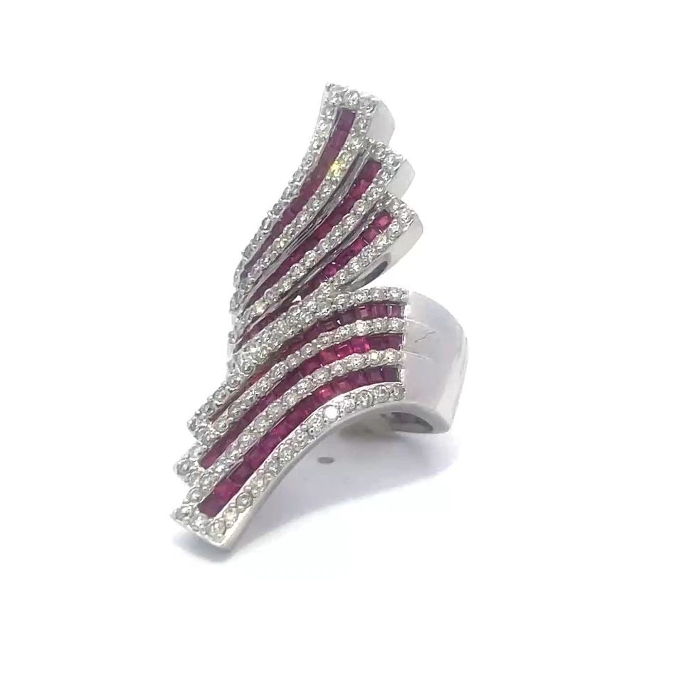 70740 DIAMOND RUBY GOLD RING 6.25CT 14K WHITE BYPASS RIBBON STYLE LARGE: 70740 DIAMOND RUBY GOLD RING 6.25CT 14K WHITE BYPASS RIBBON STYLE LARGE This is a stunning bypass diamond and ruby ring, it is a piece of fine jewelry that features a large multi-rows ribbon style des