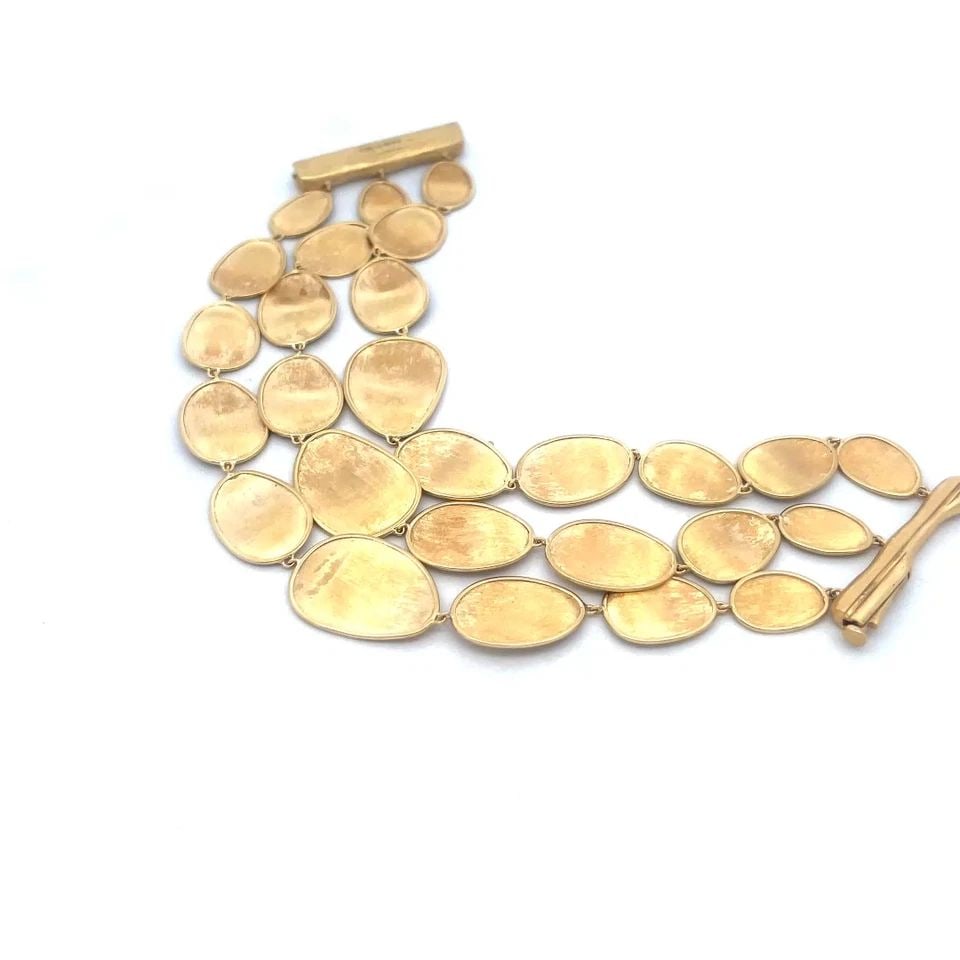 MARCO BICEGO LUNARIA GOLD BRACELET 18K YELLOW TRIPLE ROW DISC LINK: MARCO BICEGO LUNARIA GOLD BRACELET 18K YELLOW TRIPLE ROW DISC LINK This is a Marco Bicego Lunaria bracelet crafted in 18k yellow gold from Italy. The bracelet features a triple row of disc links in an
