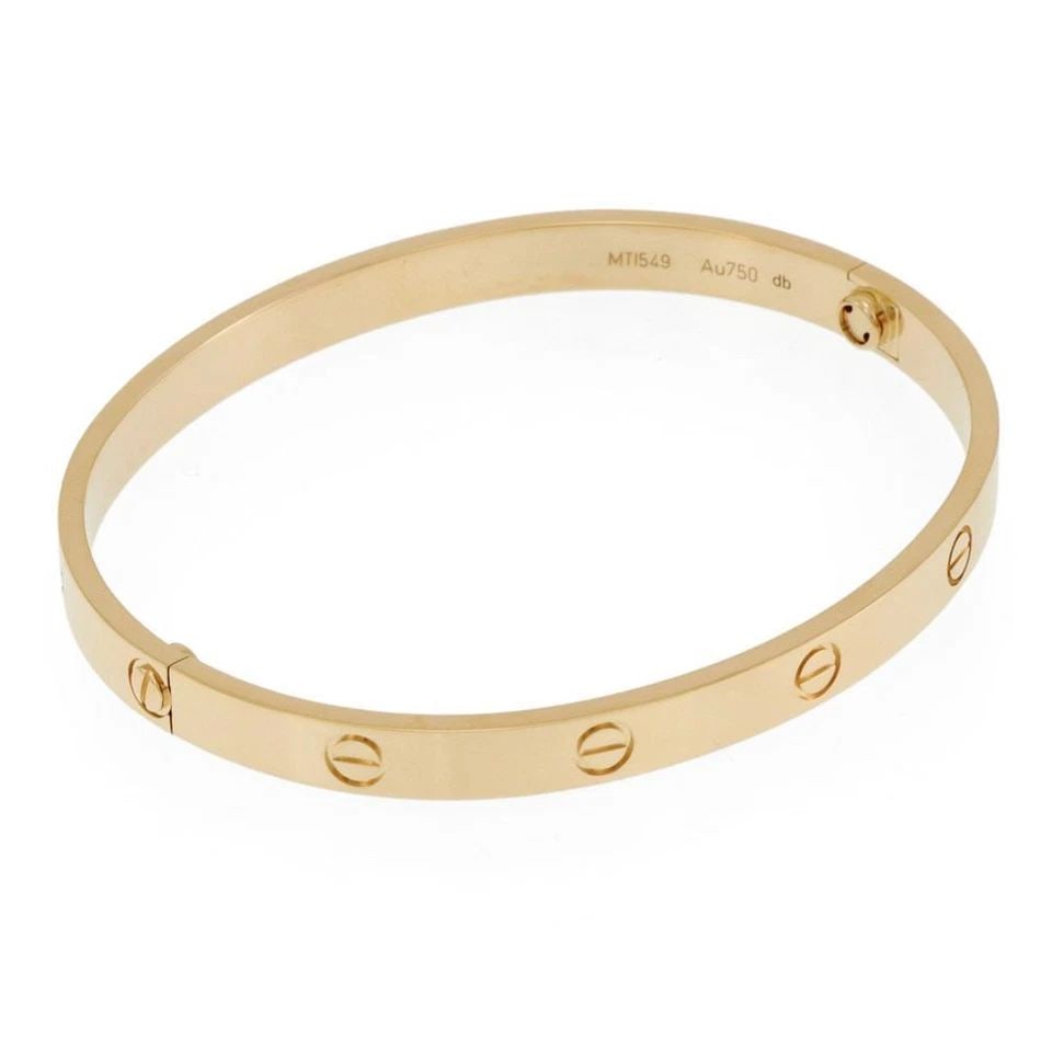 CARTIER LOVE 18K YELLOW GOLD CLASSIC MODEL BANGLE SIZE 20 W/CERT & SCREWDRIVER: CARTIER LOVE 18K YELLOW GOLD CLASSIC MODEL BANGLE SIZE 20 W/CERT & SCREWDRIVER Cartier Love 18k Yellow Gold Classic Model Bangle Size 20 w/Cert & Screwdriver Description This is the iconic authentic b