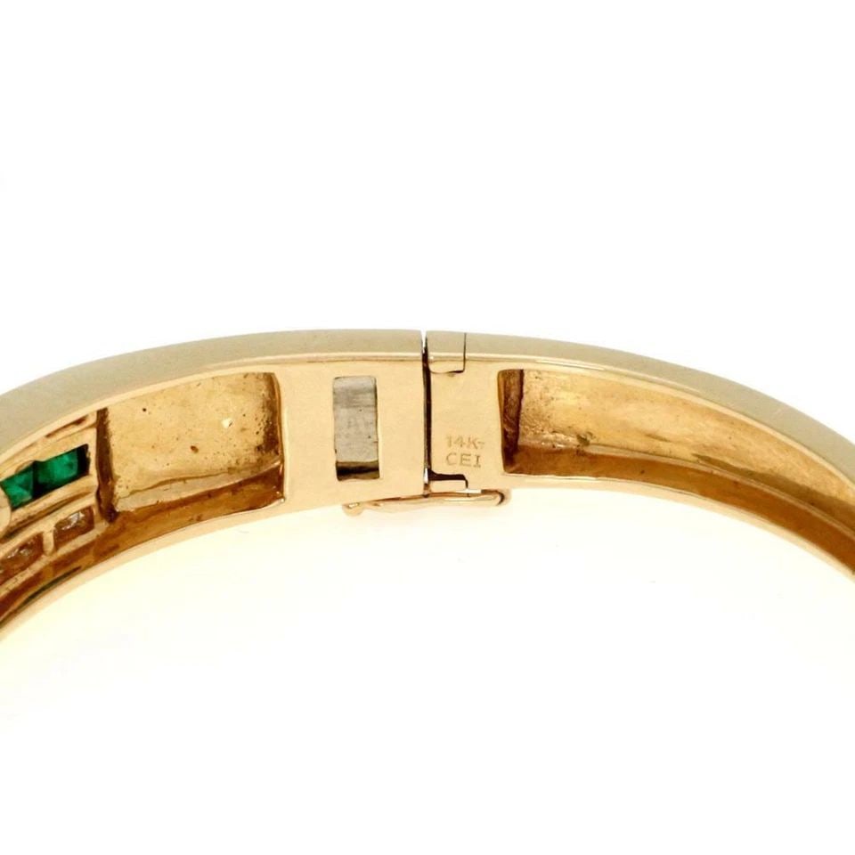ESTATE 5.50CT DIAMOND & EMERALD 14K YELLOW GOLD BANGLE BRACELET: ESTATE 5.50CT DIAMOND & EMERALD 14K YELLOW GOLD BANGLE BRACELET Estate 5.50ct Diamond & Emerald 14k Yellow Gold Bangle Bracelet Description This is a beautiful Estate bracelet, it is crafted from 14k 