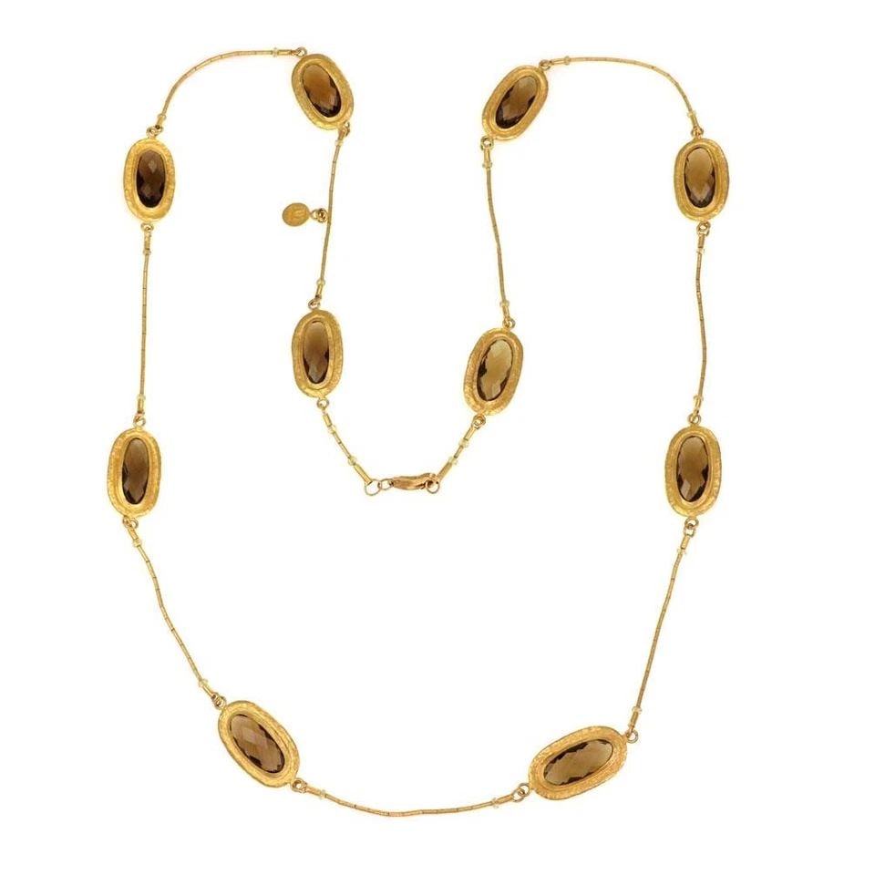 GURHAN NECKLACE SMOKY QUARTZ 24K YELLOW GOLD OVAL STATION: GURHAN NECKLACE SMOKY QUARTZ 24K YELLOW GOLD OVAL STATION The Gurhan Necklace featuring a smoky quartz oval station in 24k yellow gold is a fancy and stylish piece of fine jewelry. This natural gemsto