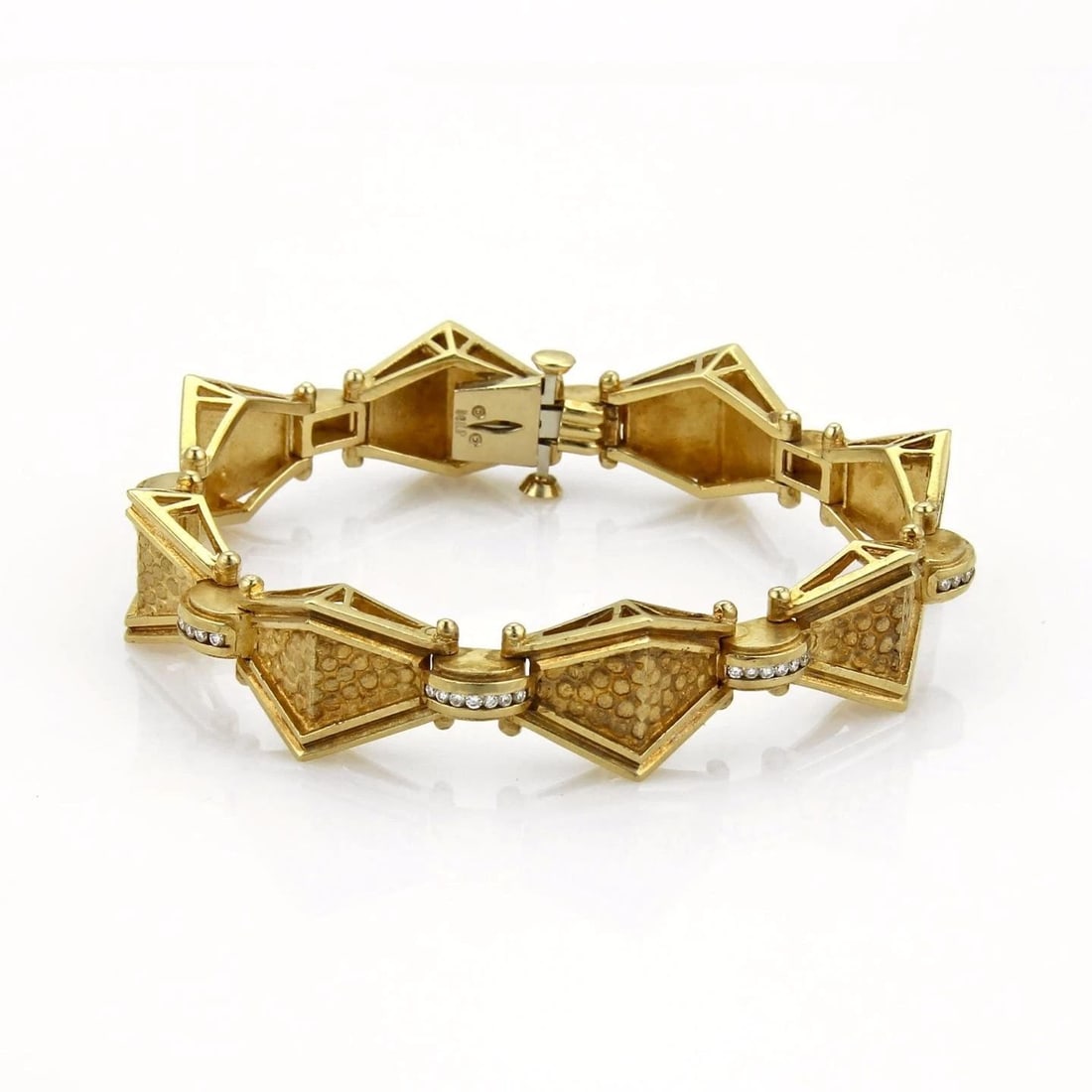 DIAMOND GOLD BRACELET 14K YELLOW FANCY GEOMETRIC LINKS: DIAMOND GOLD BRACELET 14K YELLOW FANCY GEOMETRIC LINKS This is an interesting vintage bracelet, it is crafted from 14k yellow gold with a textured and polished finish and features 8 fancy geometric sh