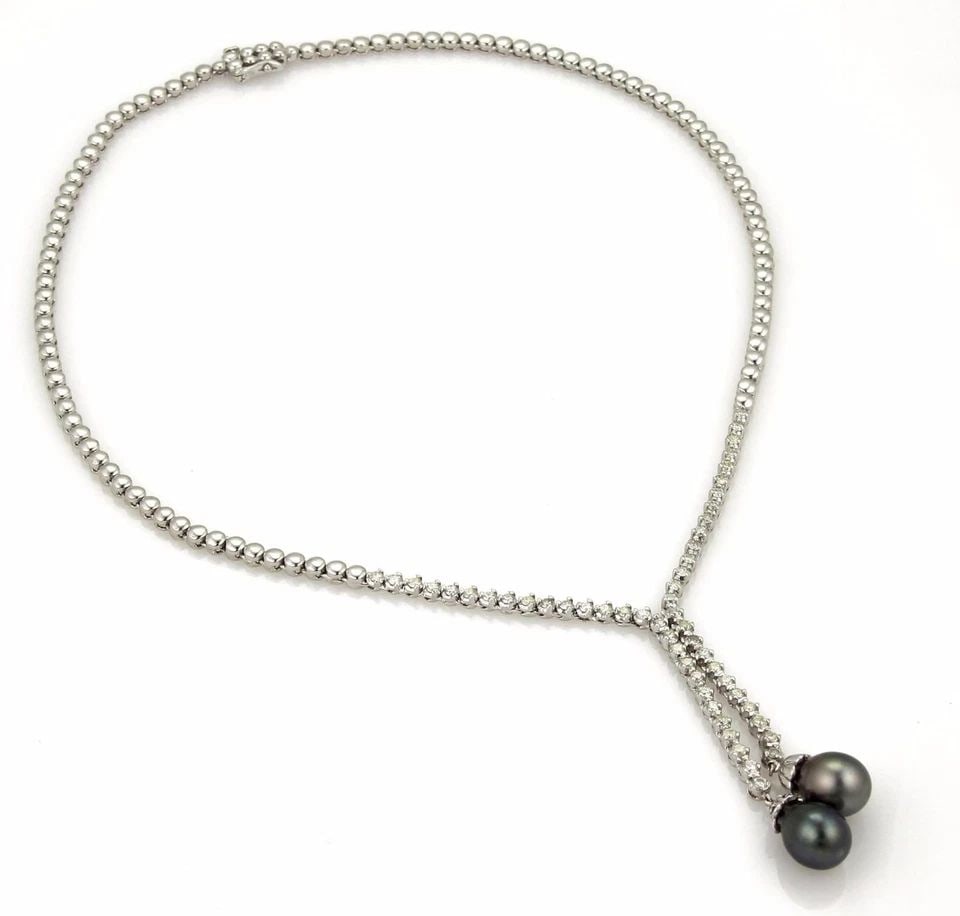 DIAMOND GOLD NECKLACE 14K WHITE 1.50CT DOUBLE LARIAT PENDANT ESTATE BEAD STYLE: DIAMOND GOLD NECKLACE 14K WHITE 1.50CT DOUBLE LARIAT PENDANT ESTATE BEAD STYLE This is a stunning Estate necklace, well-crafted from 14k white gold with a polished finish. It features a double dangle 