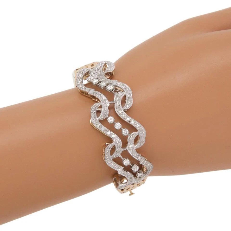 66469 ESTATE 2.4CT DIAMOND 14K TWO TONE GOLD SCROLL DESIGN FANCY BRACELET: 66469 ESTATE 2.4CT DIAMOND 14K TWO TONE GOLD SCROLL DESIGN FANCY BRACELET 66469 Estate 2.4ct Diamond 14k Two Tone Gold Scroll Design Fancy Bracelet Description This gorgeous Estate bracelet is crafted
