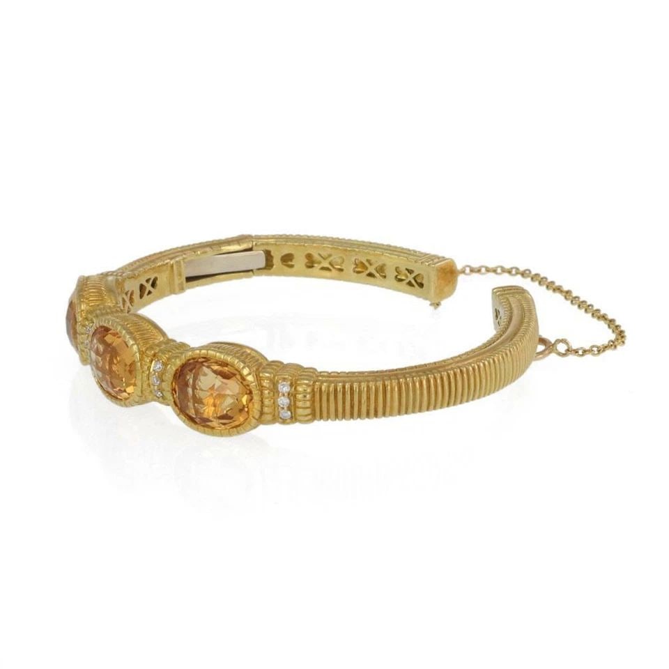 JUDITH RIPKA CUFF ORANGE GEMSTONES & DIAMONDS 18K YELLOW GOLD BRACELET: JUDITH RIPKA CUFF ORANGE GEMSTONES & DIAMONDS 18K YELLOW GOLD BRACELET The Judith Ripka Cuff Orange Gemstones & Diamonds 18k Yellow Gold Bracelet is a stunning piece of fine jewelry made in the United