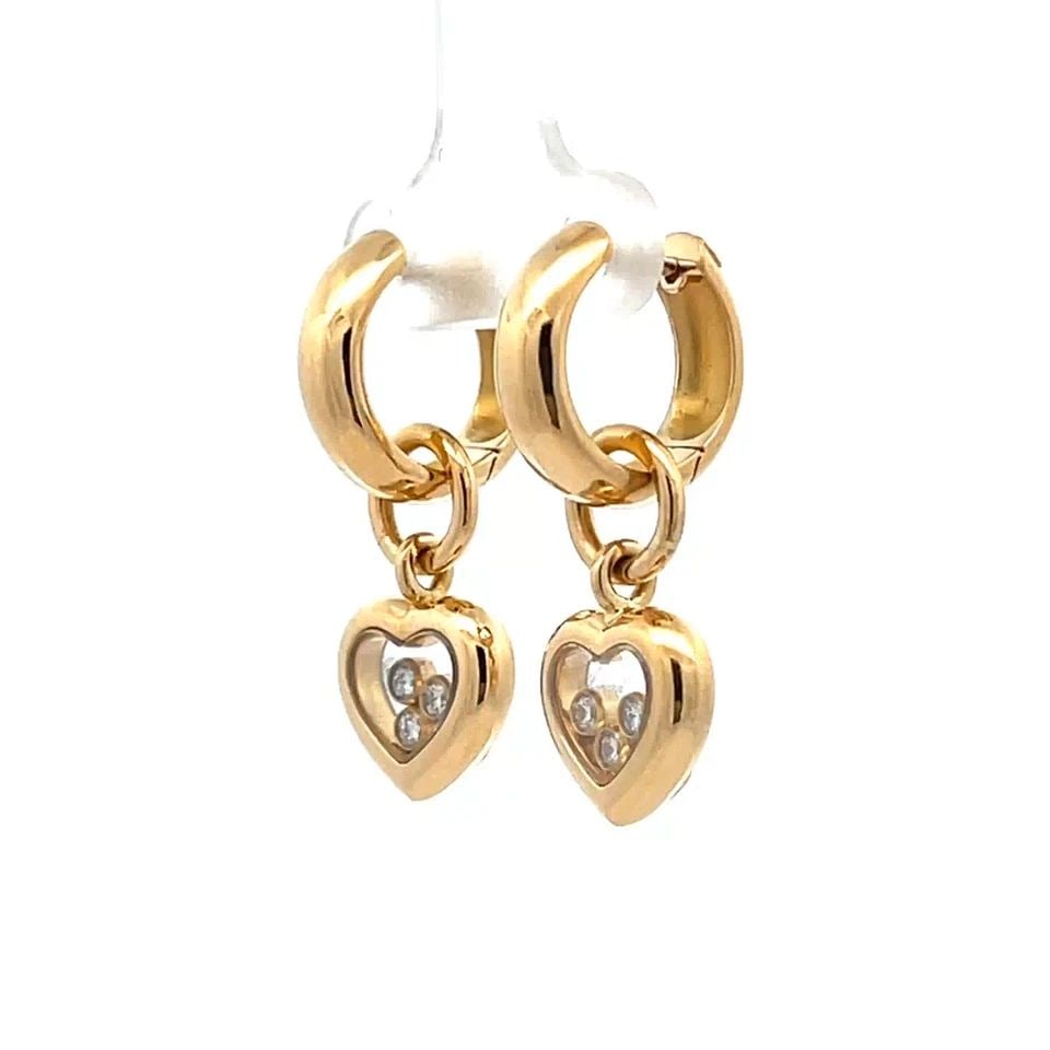 CHOPARD HAPPY DIAMOND 18K YELLOW GOLD DANGLE HEARTS EARRINGS: CHOPARD HAPPY DIAMOND 18K YELLOW GOLD DANGLE HEARTS EARRINGS From the Happy Diamond Collection by Chopard, these beautiful dangle earrings are crafted from 18k yellow gold featuring a small hoop top w