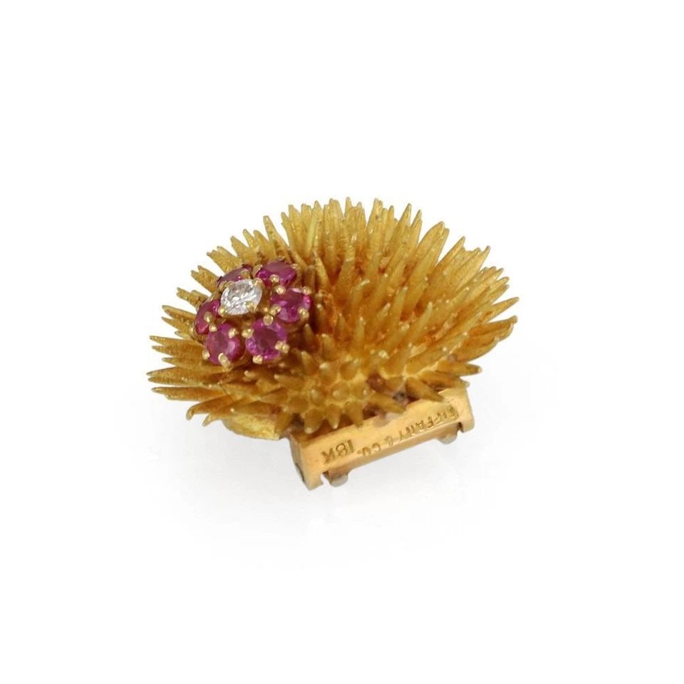 TIFFANY & CO. VINTAGE RUBY DIAMONDS 18K GOLD SEA URCHIN FLOWER BROOCH: TIFFANY & CO. VINTAGE RUBY DIAMONDS 18K GOLD SEA URCHIN FLOWER BROOCH Tiffany & Co. Vintage Ruby Diamonds 18k Gold Sea Urchin Flower Brooch Description This lovely authentic vintage brooch is from Tif