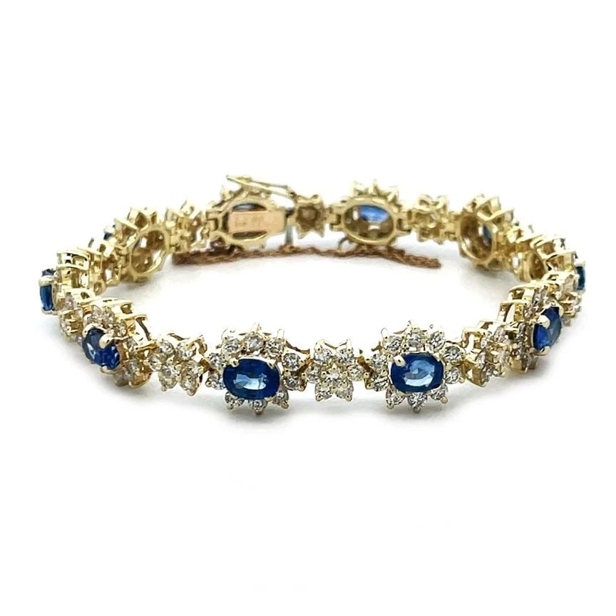 DIAMOND SAPPHIRE GOLD BRACELET 14K YELLOW FLORAL LINK STYLE: DIAMOND SAPPHIRE GOLD BRACELET 14K YELLOW FLORAL LINK STYLE Add this exquisite diamond and sapphire gold bracelet to your collection today! It is a stunning piece of fine jewelry featuring a full leng