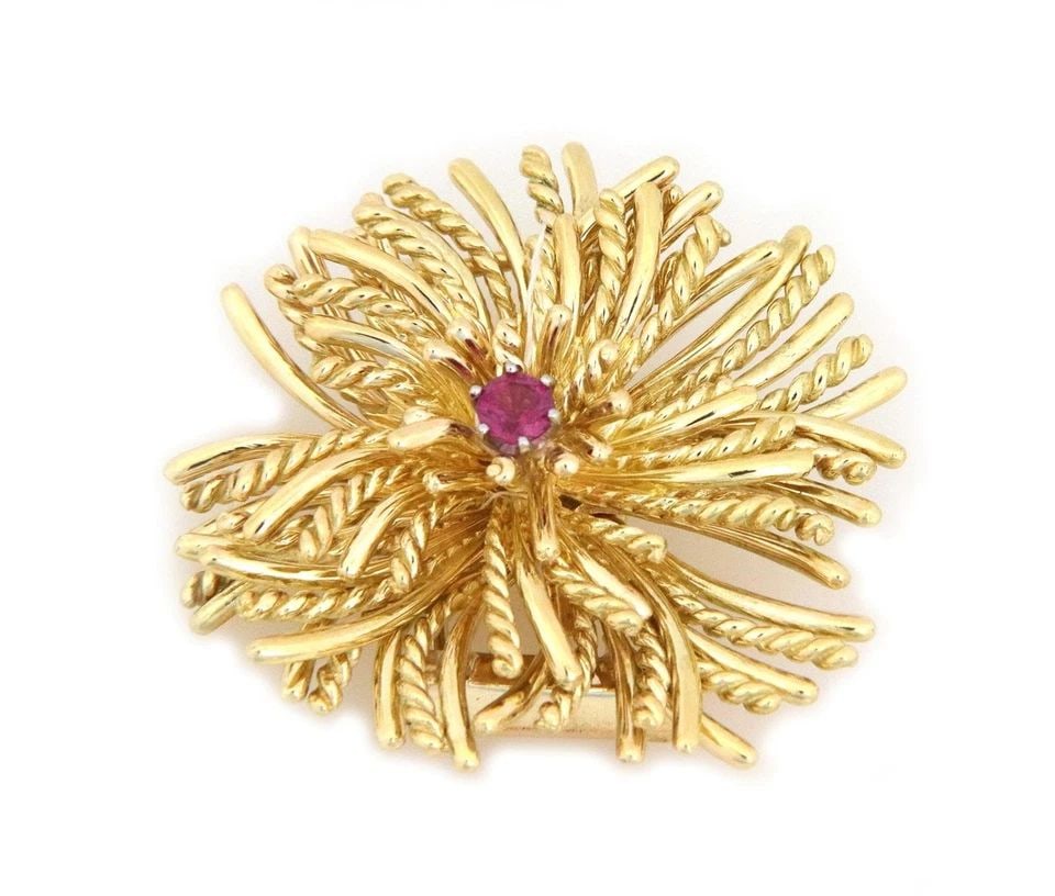 TIFFANY & CO. RUBY 18K YELLOW GOLD CLUSTER PETALS FLOWER BROOCH: TIFFANY & CO. RUBY 18K YELLOW GOLD CLUSTER PETALS FLOWER BROOCH Tiffany & Co. Ruby 18k Yellow Gold Cluster Petals Flower Brooch Description This is a lovely authentic brooch from Tiffany & Co. It is c