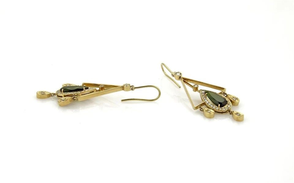 DIAMOND & GEMS GOLD EARRINGS 5.90CT 18K YELLOW CHANDELIER STYLE: DIAMOND & GEMS GOLD EARRINGS 5.90CT 18K YELLOW CHANDELIER STYLE These beautiful diamond and tourmaline earrings feature a chandelier design set in 18k yellow gold. The large green gemstones are tourma
