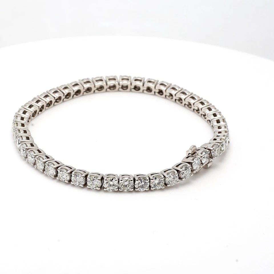 9.57CT G VS1 ROUND BRILLIANT DIAMOND PLATINUM TENNIS BRACELET – 7 INCH: 9.57CT G VS1 ROUND BRILLIANT DIAMOND PLATINUM TENNIS BRACELET – 7 INCH Title: This exquisite platinum tennis bracelet features 45 round brilliant diamonds totaling an impressive 9.57 carats, each gr
