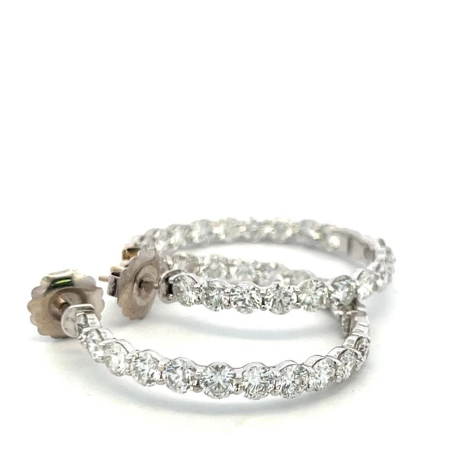VINTAGE 14K WHITE GOLD HOOP EARRINGS WITH 11 CARAT ROUND H-VS DIAMONDS 1.5 INCH: VINTAGE 14K WHITE GOLD HOOP EARRINGS WITH 11 CARAT ROUND H-VS DIAMONDS 1.5 INCH Detailed Description: Elevate your elegance with these luxurious hoop earrings crafted from 14 karat white gold. Adorned